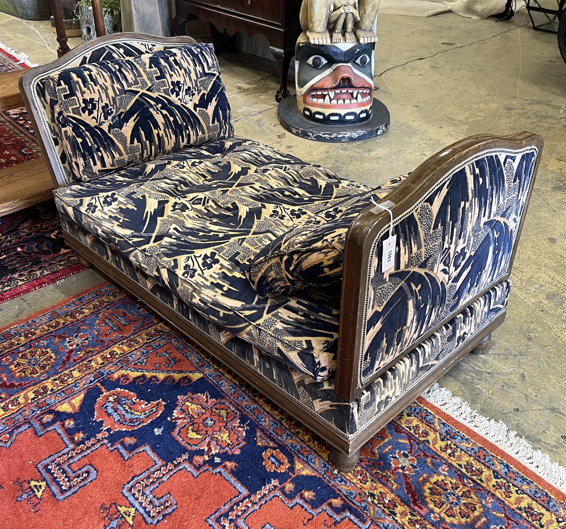 A French Art Deco beech daybed, length 130cm, depth 72cm, height 74cm